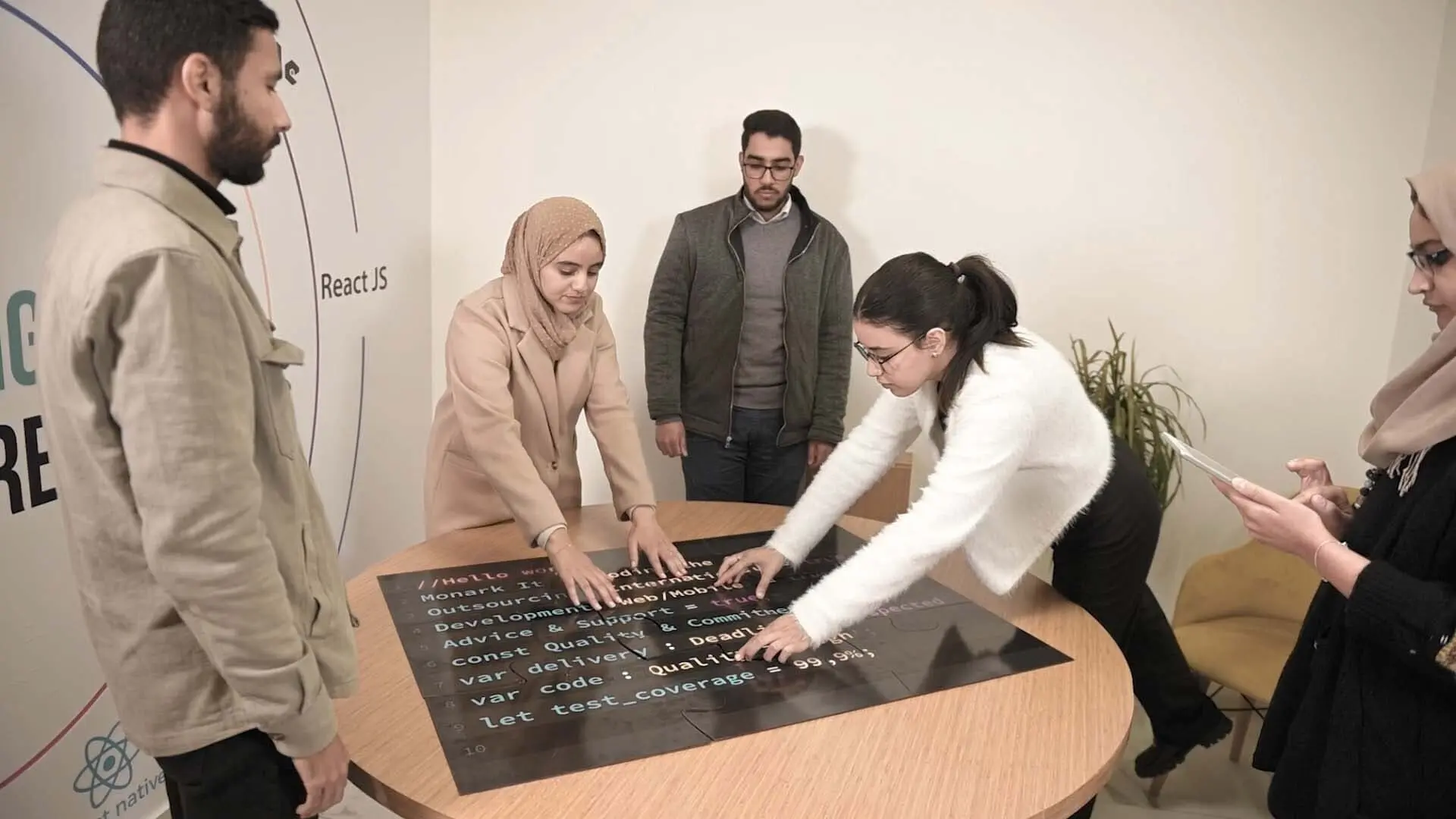 Monark IT development team collaborating on a project